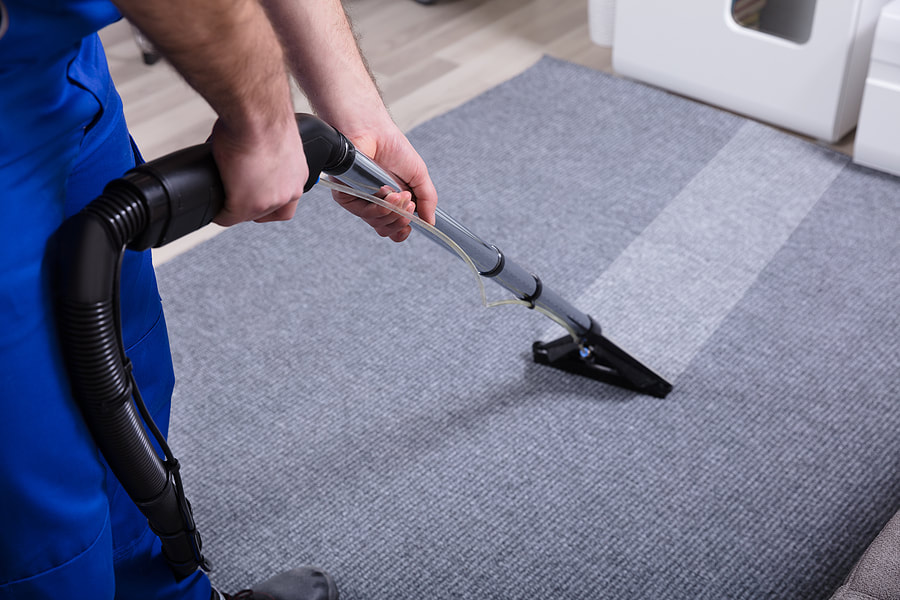 vacuuming the dirty mat