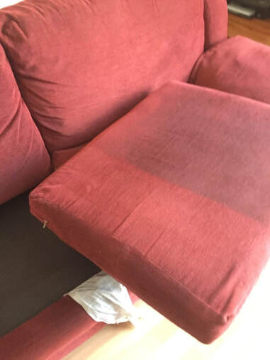a sofa at a client home in scottsdale being cleaned